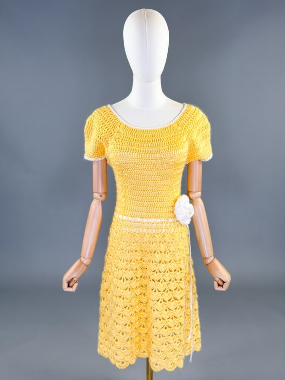 Vintage 1960s Handmade Crochet Floral Dress: Vintage 1960s Handmade Crochet Floral Dress having floral detail at waist with adjustable ribbon tie and center back button closure. Measuring 32-40 inch bust, 24-38 inch waist, 40 inches long, 6 inch