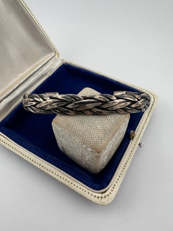 Native American Sterling Silver Braided Bracelet: Native American Sterling Silver Braided Bracelet. Cuff design. Measures approximately 2.75 inches across the interior opening as shown but is adjustable. Weighs approximately 30 grams.