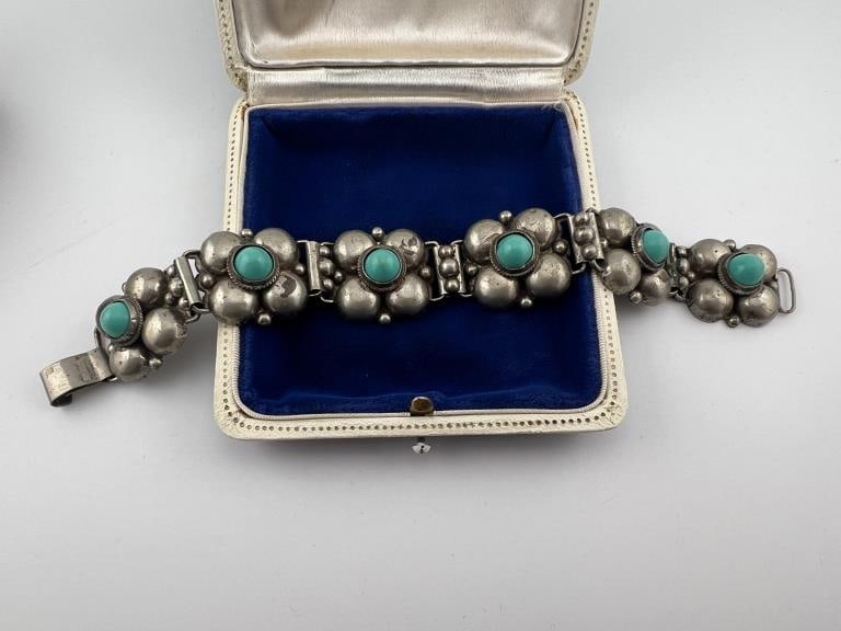 Native American Style Silver & Turquoise Bracelet: Native American Style Silver & Turquoise Bracelet. Articulated panel bracelet in low grade silver or silver plate with turquoise tone cabochons at the center of each panel. Stamped MEXICO SILVER Measu