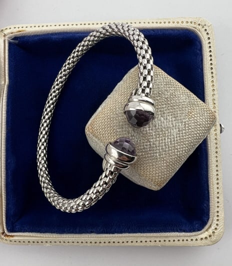 Sterling Aquamarine David Yurman Style Bracelet: Sterling Aquamarine David Yurman Style Bracelet. Italian made sterling silver cuff bracelet set with briolette cut aquamarine or blue topaz. Hallmarked and stamped ITALY. Stones may be enhanced. Measu