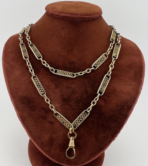 Antique Filigree Watch Chain Necklace w Dog Clip: Antique Filigree Watch Chain Necklace w Dog Clip. Oval links with filigree detail inside the oval frames. Measures 28 inches in length.