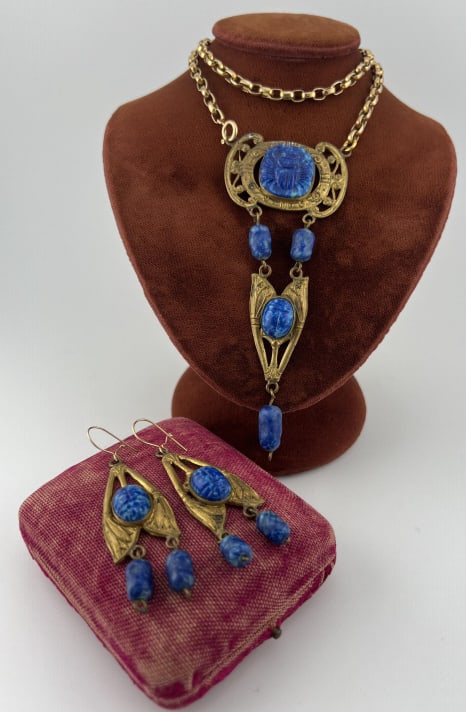 Antique Art Deco Max Neiger Style Egyptian Jewelry: Antique Art Deco Max Neiger Style Egyptian Jewelry. Gilt metal and molded glass to resemble lapis lazuli with Egyptian style details including scarab. Necklace chain measures 16 inches in length.