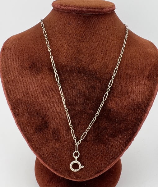 Antique Sterling Trombone Link Necklace Chain: Antique Sterling Silver Trombone Link Necklace Chain. Having a spring ring clasp and a spring spring to hold a pendant, both are hallmarked. Chain measures 18 inches in length.