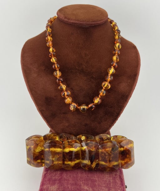 Vintage Amber Beaded Strand & Panel Bracelet: Vintage Amber Beaded Strand & Panel Bracelet. Hand knotted strand measures 12 inches, panel bracelet measures just under 8 inches.