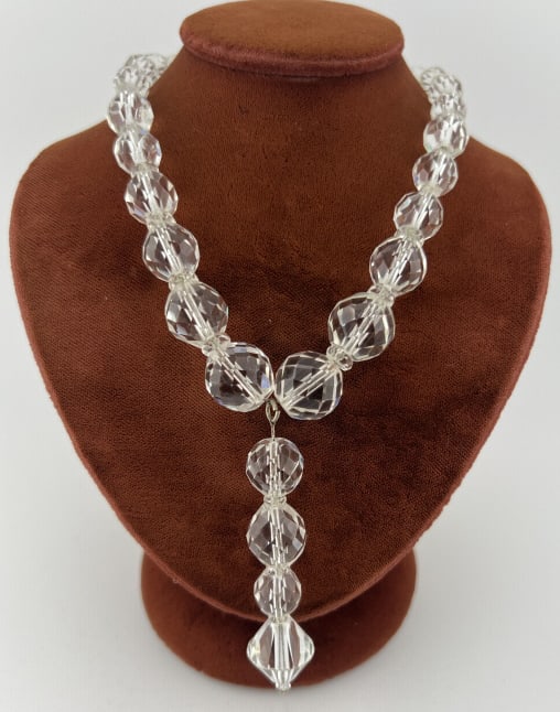 Antique Art Deco Flapper Faceted Crystal Necklace: Antique Art Deco Flapper Faceted Crystal Necklace. White gold filled clasp. Crystal pendant drop at center. Measures approximately 16 inches in length, plus pendant drop.