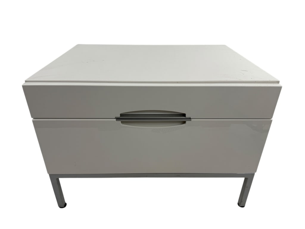 Contemporary Modern White Lacquered Nightstand: Contemporary Modern White Lacquered Nightstand. White lacquer paint finish. Silver tone hardware. Measures 17.5 inches in height, 25.25 inches in width and 19 inches in depth.