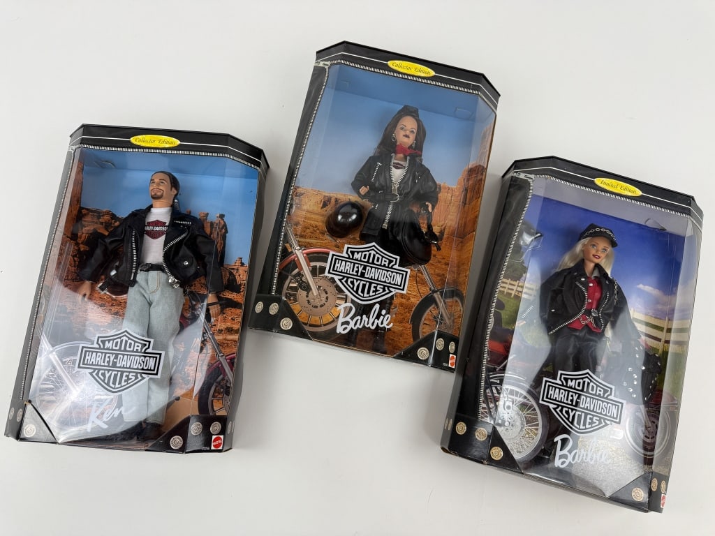 Three Harley Davidson Theme Barbie & Ken Dolls: Three Harley Davidson Theme Barbie & Ken Dolls. Three Barbie and Ken dolls still in their original boxes. One box measures 13.5 x 9 x 3 inches.