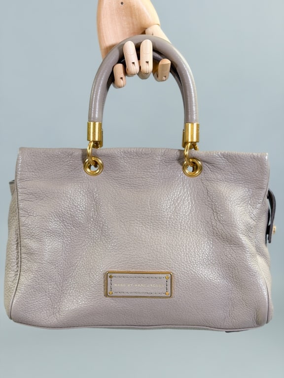 Vintage Marc by Marc Jacobs Leather Satchel Bag: Vintage Marc by Marc Jacobs Leather Satchel Bag having zip top closure with removable cross body strap. Measuring approximately 15 inches by 8.5 inches by 5 inches. General wear as shown throughout.