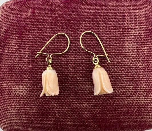 Estate Pair 14kt Gold Floral Motif Coral Earrings: Estate Pair 14kt Gold Floral Motif Coral Earrings. Pair of 14kt yellow gold ear wires, hallmarked 14k, set with carved coral floral motif drops. Each measures just over 1 inch in length.