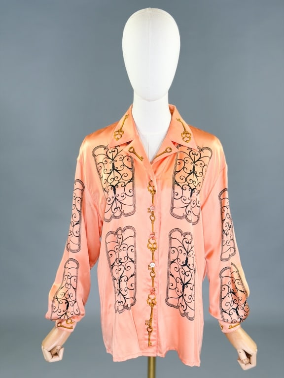 Vintage 1990s Escada Silk Printed Button Up Shirt: Vintage 1990s Escada Silk Printed Button Up Shirt having print throughout. Marked size 38. Measuring 44 inch bust, 26 inches long, 23 inch sleeve length.