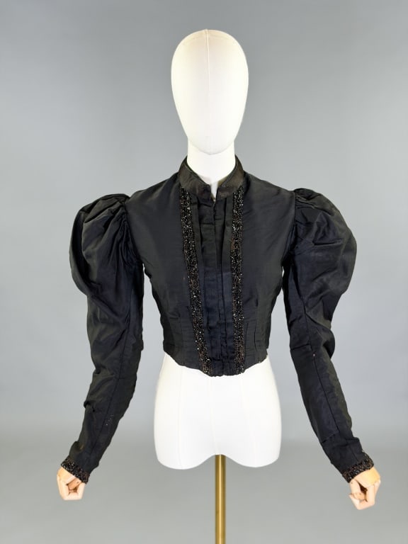 Antique Victorian 1890s Mutton Sleeve Cotton Top: Antique Victorian 1890s Mutton Sleeve Cotton Bodice Top having center front hook closure with beaded details throughout. Measuring 38 inch bust, 32 inch waist, 16 inches long, 25 inch sleeve length. G