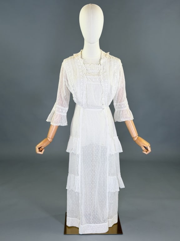 Antique Edwardian 1900s Cotton Tea Lawn Dress: Antique Edwardian 1900s Cotton Tea Lawn Dress having floral and Greek key embroidery throughout closing with hooks at front. Measuring 32-40 inch bust, 24 inch waist, 47 inches long, 16 inch sleeve le