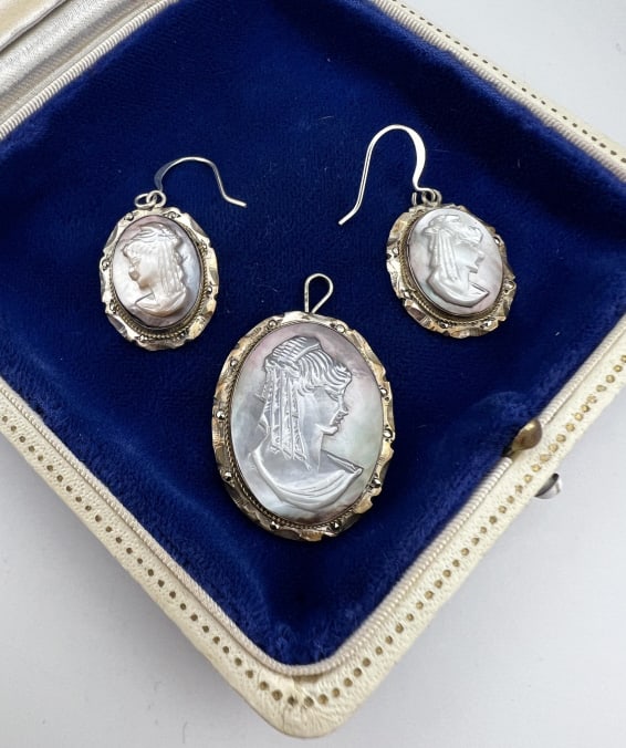 Antique Silver & Mother of Pearl Cameo Jewelry Set: Antique Silver & Mother of Pearl Cameo Jewelry Set. Necklace pendant and pair of earrings, set in 800 silver. Bottom of the necklace pendant is faintly hallmarked 800. Set with hand carved mother of p