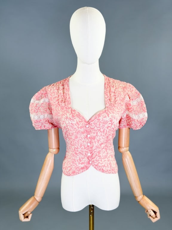 Vintage 1930s Printed Sheer Puff Sleeve Lace Top: Vintage 1930s Printed Sheer Puff Sleeve Lace Top having snap front closure. Measuring 38 inch bust, 32 inch waist, 18 inches long, 9 inch sleeve length. General wear as shown throughout.