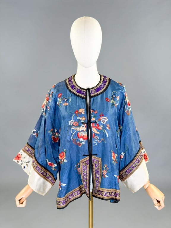 Antique 1920s Silk Floral Embroidered Chinese Robe: Antique 1920s Silk Floral Embroidered Chinese Robe having floral embroidery throughout with frog closures at center front. Measuring one size fits most, 25 inches long, 17 inch sleeve length. General 