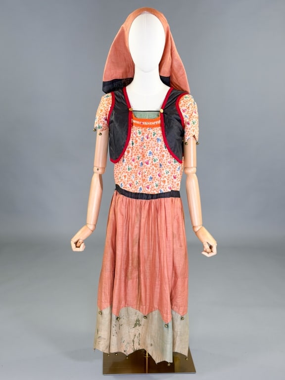 Antique 1920s Cotton Fortune Teller Costume: Antique 1920s Cotton Fortune Teller Costume having bell detail and floral print throughout with matching head scarf, no closures, slides over head. Measuring 36 inch bust, 38 inch waist, 45 inches lon