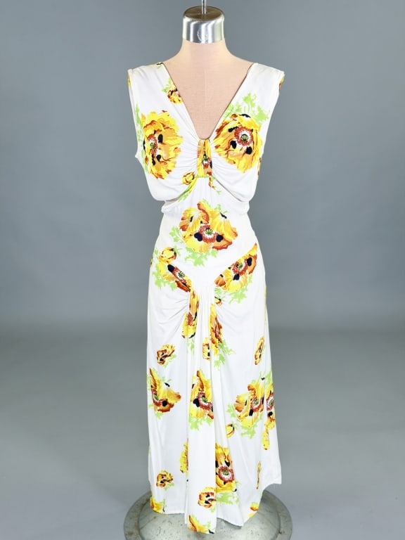 Vintage 1940s Printed Rayon Knit Draped Dress: Vintage1940s Printed Rayon Knit Draped Dress having side zip closure and draped details throughout. Measuring 32-38 inch bust, 24-28 inch waist, 44 inches long. General wear as shown throughout.
