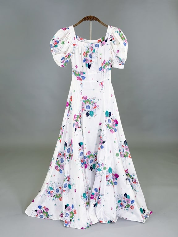 Vintage 1940s Cotton Floral Puff Sleeve Maxi Dress: Vintage 1940s Cotton Floral Puff Sleeve Maxi Dress having side zip closure. Measuring 30 inch bust, 24 inch waist, 52 inches long. 10 inch sleeve length. General wear as shown throughout.