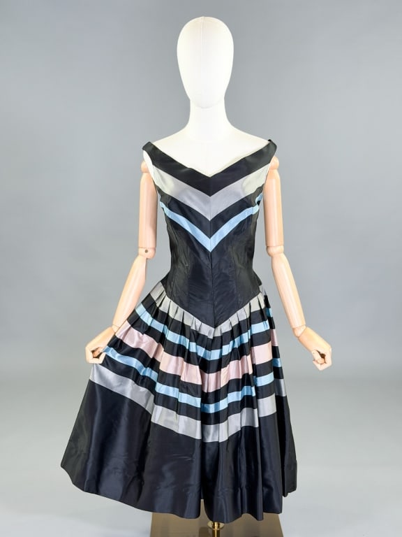 Vintage 1950s Striped Satin Cocktail Dress: Vintage 1950s Striped Satin Cocktail Dress having back zip closure and pleats through skirt. Measuring 38 inch bust, 30 in waist, 43 inches long. General wear as shown throughout.