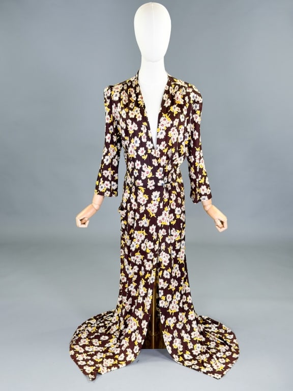 Vintage 1940s Floral Rayon Knit Wrap Robe Dress: Vintage 1940s Floral Rayon Knit Wrap Robe Dress having hook closure at waist. Measuring 34-44 inch bust, 28-32 inch waist, 56 inches long, 19 inch sleeve length. General wear as shown throughout.