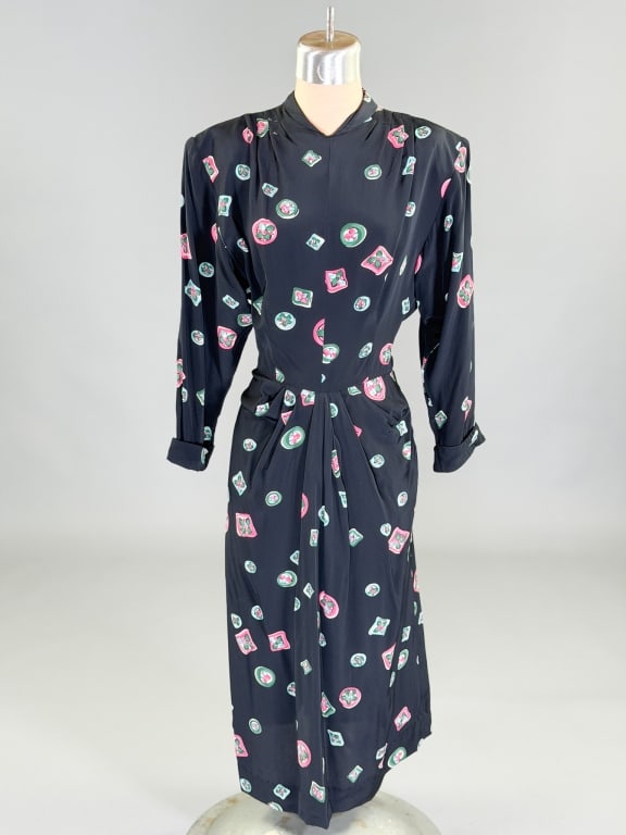 Vintage 1940s Printed Rayon Day Dress: Vintage 1940s Printed Rayon Day Dress having side and back zip closures. Measuring 34 bust, 26 waist, 42 inches long, 19 inch sleeve length. General wear as shown throughout.