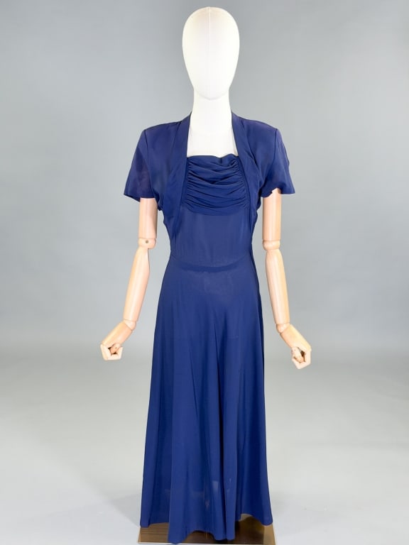 Vintage 1940s Rayon Crepe Ruched Day Dress: Vintage 1940s Rayon Crepe Ruched Day Dress having side zip closure. Measuring 36 inch bust, 26 inch waist, 48 inches long, 7 inch sleeve length. General wear as shown throughout.