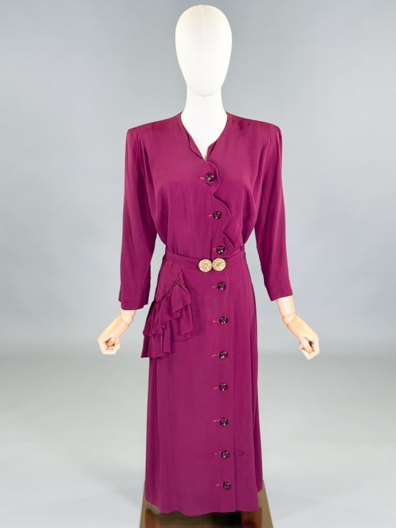 Vintage 1940s Scallop Ruffle Button Dress: Vintage 1940s Scallop Ruffle Button Dress having button front closure and ruffle detail at hip with belt at waist. Measuring 42 inch bust, 32 inch waist, 47 inches long, 20 inch sleeve length. General