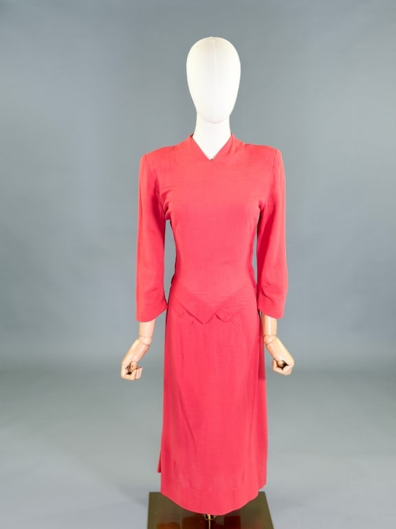 Vintage 1940s Rayon Crepe Day Dress: Vintage 1940s Rayon Crepe Day Dress having side zip closure and peplum detail at waist. Measuring 34 inch bust, 26 inch waist, 46 inches long, 20 inch sleeve length. General wear as shown throughout.