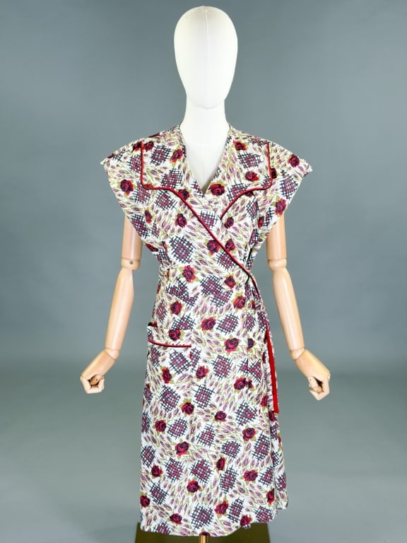 Vintage 1950s Floral Cotton Wrap Dress: Vintage 1950s Floral Cotton Wrap Dress having wrap tie at waist. Measuring 34-40 inch bust, adjustable waist, 43 inches long, 4 inch sleeve length.