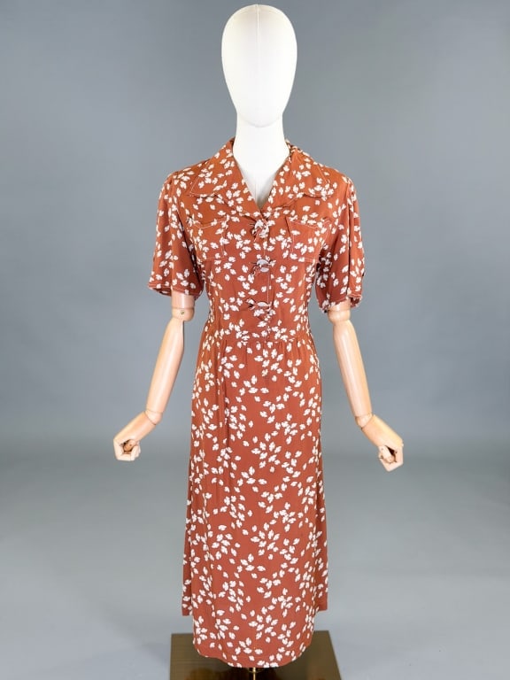 Vintage 1940s Rayon Printed Shirt Dress: Vintage 1940s Rayon Printed Shirt Dress having button front and side snap closure with two front patch pockets. Measuring 40 inch bust, 34 inch waist, 45 inches long, 10 inch sleeve length. General we