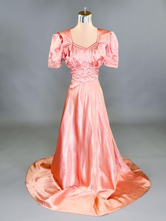 Vintage 1940s Rayon Satin Trapunto Dress Gown: Vintage 1940s Rayon Satin Trapunto Dress Gown having side zip closure and tie at waist. Measuring 36 inch bust, 30 inch waist, 56 inches long, 11 inch sleeve length. General wear as shown throughout.