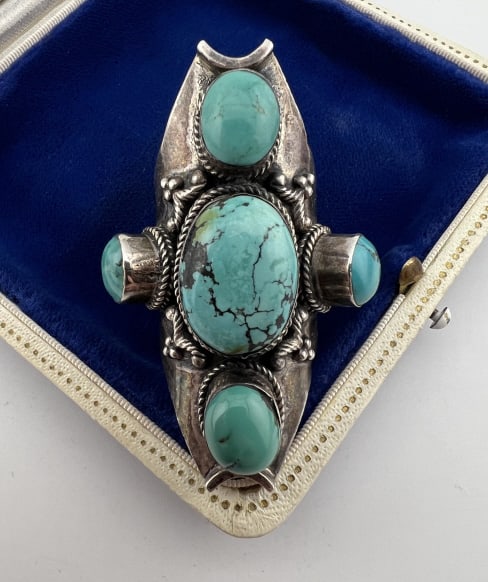 Large Native American Sterling Turquoise Ring: Vintage Large Scale Native American Sterling & Turquoise Ring. Hallmarked 925. Set with five cabochon turquoise stones. Top of ring measures 2.25 inches in length. Ring size 10