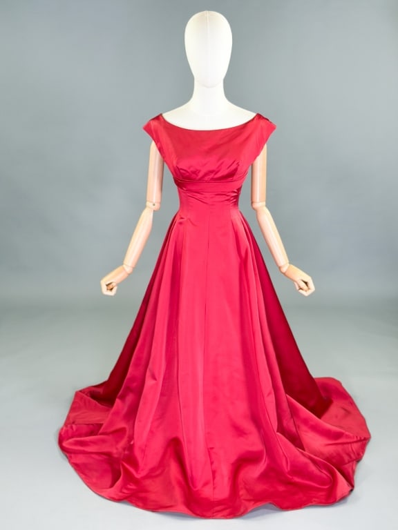 Vintage 1950s Satin Empire Waist Evening Gown: Vintage 1950s Satin Empire Waist Evening Gown having back zip closure with bow detail. Measuring 32 inch bust, 24 inch waist, 54 inches long. General wear as shown throughout.