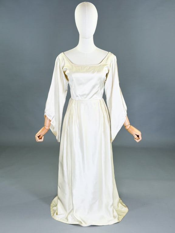 Vintage 1960s Angel Wing Wedding Bridal Gown: Vintage 1960s Angel Wing Wedding Bridal Gown having back zip closure. Measuring 34 inch bust, 26 inch waist, 51 inches long, 25 inch sleeve length. General wear as shown throughout.