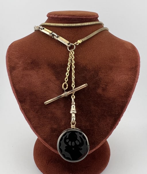Antique Gold Filled Watch Chain Necklace w Jet Fob: Antique Gold Filled Watch Chain Necklace w Jet Fob. Articulated chain and panel chain with spring ring clasp, drop with antique gold filled dog clip and T bar. Measures 20 inches in length, drop with 
