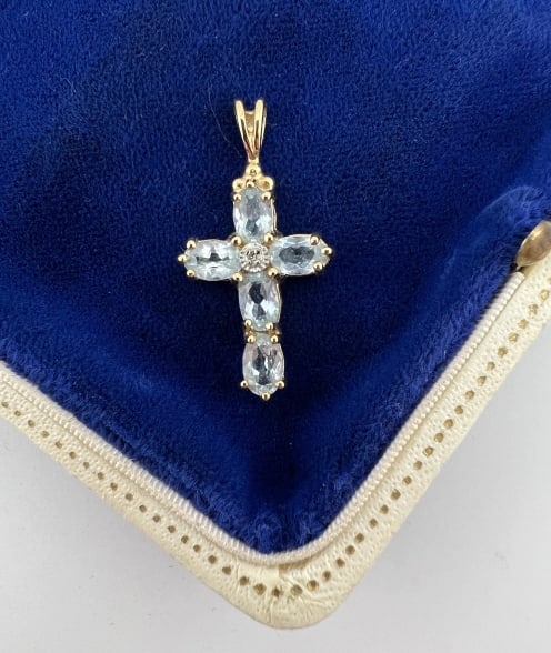Gold Over Sterling Silver & Aquamarine Cross: Gold Over Sterling Silver & Aquamarine Cross Necklace Pendant.. Hallmarked. Stones may be treated / enhanced. Measures 1.25 inches in length.