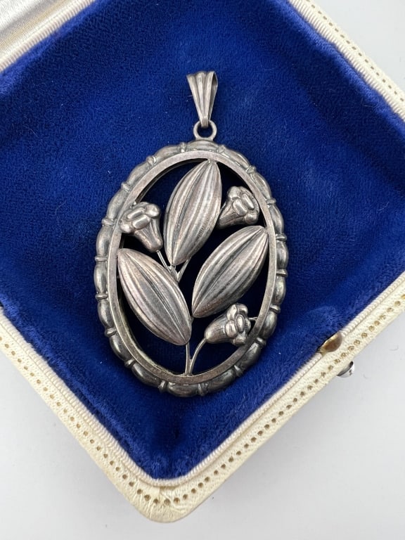 Antique 800 Silver European Art Deco Pendant: Antique 800 Silver European Art Deco Pendant. Floral design within oval frame. Stamped 800 on the back. Measures 2.5 inches in length.