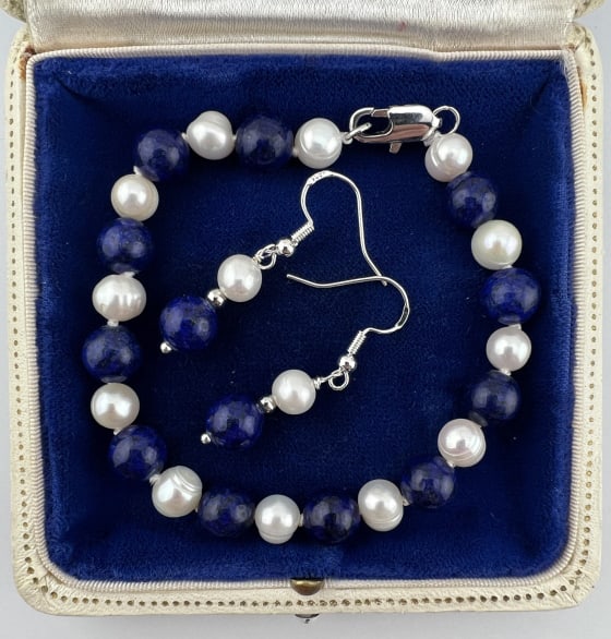 Lapis Lazuli & Baroque Pearl Bracelet Earring Set: Lapis Lazuli & Baroque Pearl Bracelet & Earring Set. Bracelet hand knotted on white silk thread, earring wires are stamped 925. Set with approximately 6mm lapis lazuli with gold flecks / veining and c