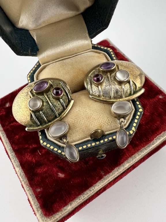 Pair Artisan Sterling Gold & Moonstone Earrings: Pair Artisan Sterling Gold & Moonstone Earrings. Gold over sterling silver and set with cabochon moonstones and garnet. Hallmarked. Each measures 1.25 inches in length.