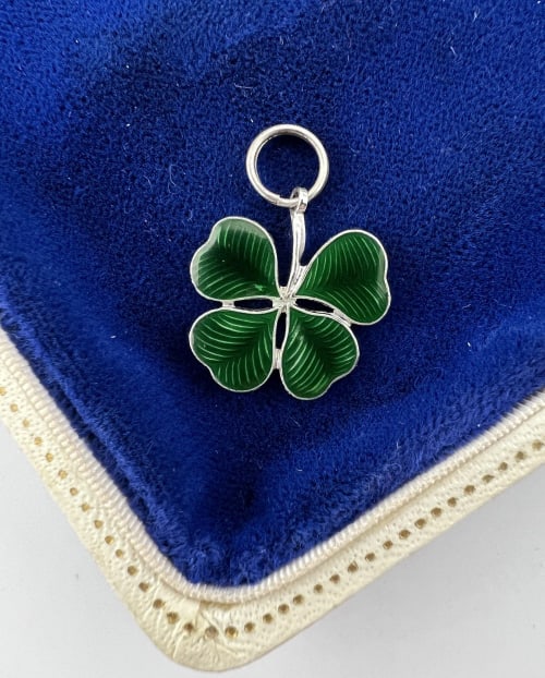 Antique Sterling Silver & Enamel Clover Pendant: Antique Sterling Silver & Enamel Clover Necklace Pendant or Charm. Stamped STERLING on the back. Set with green enamel. Measures 1 inch in length.