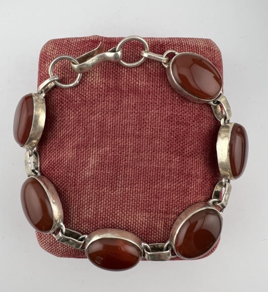 Vintage Silver Carnelian Cabochon Panel Bracelet: Vintage Silver Carnelian Cabochon Panel Bracelet. Hallmarked faintly on the clasp. Bezel set with six oval carnelian cabochons. Measures just over 8 inches in length.