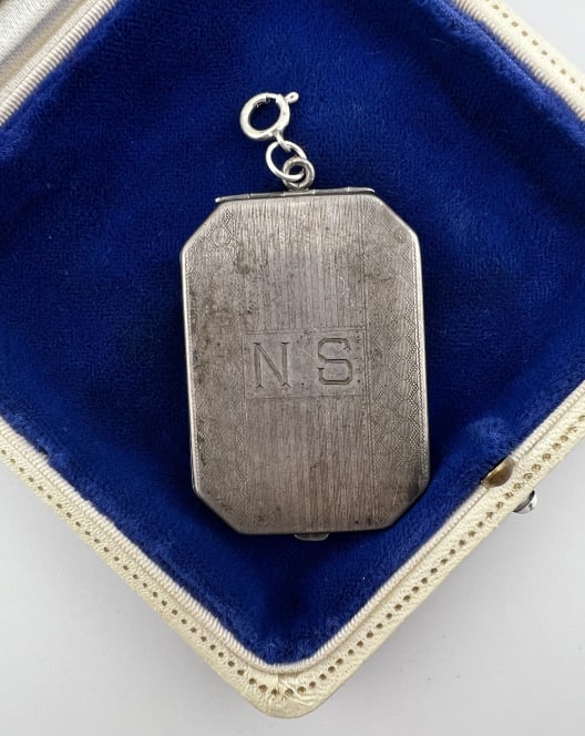 Antique Sterling Silver Art Deco Locket Pendant: Antique Sterling Silver Art Deco Locket Necklace Pendant. Clasp bail is hallmarked 925. Measures 2.5 inches in length. Monogram and stripe design on the front.