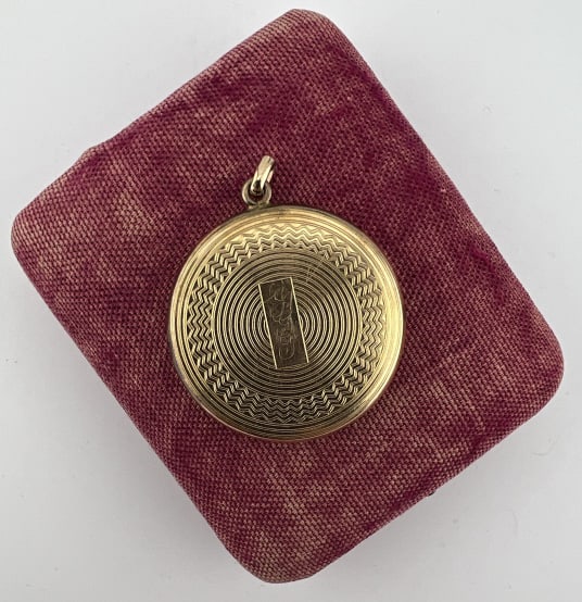 Antique Art Deco Yellow Gold Filled Locket Pendant: Antique Art Deco Yellow Gold Filled Locket Necklace Pendant. Front with stripe and patterned halo design. Measures 1.75 inches in length.