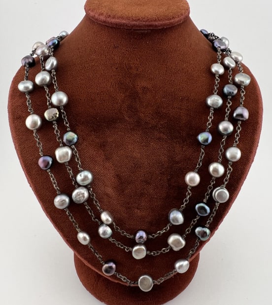 Sterling Silver Tahitian Baroque Pearl Necklace: Sterling Silver Tahitian Baroque Pearl Necklace. With three strands of multi color Tahitian style pearls in high luster tones of gray / silver / black / purple. Hallmarked. Measures 17.5 inches overal
