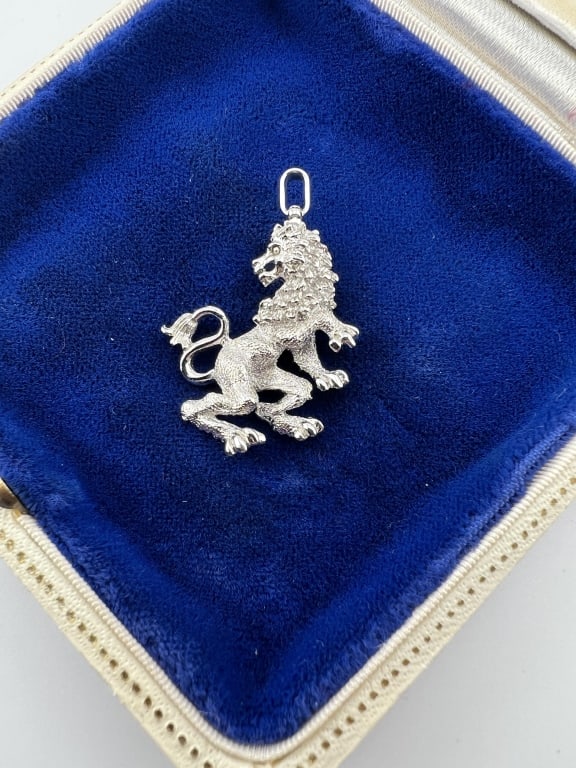 Sterling Silver Rampant Lion Necklace Pendant: Sterling Silver Rampant Lion Necklace Pendant. Sterling silver, likely with a rhodium or palladium plating as there is a high shine finish. Measures 1.5 inches in length.