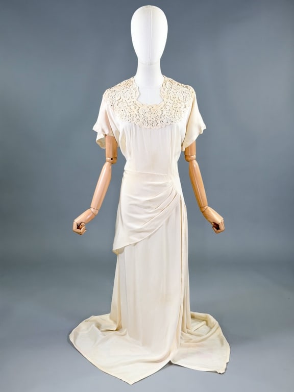 Vintage 1940s Crepe Lace Rhinestone Evening Gown: Vintage 1940s Crepe Lace Rhinestone Evening Gown having lace and prong set rhinestone details at neck & draped details through skirt, closing with zip at side. Measuring 44 inch bust, 36 inch waist, 5