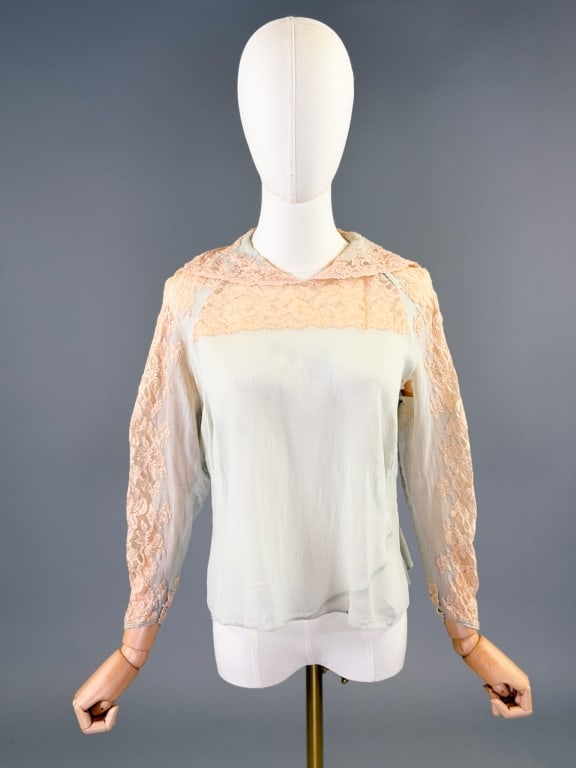 Vintage 1930s Blue Chiffon Lace Long Sleeve Blouse: Vintage 1930s Blue Chiffon Lace Long Sleeve Blouse having lace detail at neck and down sleeves, closing at neck with snaps. Measuring 38 inch bust, 21 inches long, 20 inch sleeve length. Wear as shown