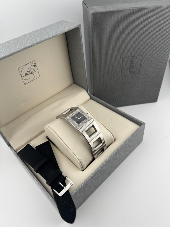Lalique French Art Glass Watch w Diamond Accents: Lalique French Art Glass Watch w Diamond Accents. Lalique Bacchantes watch. This watch comes with original box and outer case. Have French frosted art glass by Lalique as the border, diamond accents f