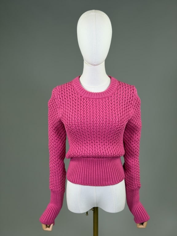 Prada Chunky Knit Sweater Top Shirt: Prada Chunky Knit Sweater Top Shirt having ribbed neck, waist and sleeve cuffs and stretch throughout. Marked size 40. Measuring 32-44 inch bust, 22-38 inch waist, 22 inches long, 31 inch sleeve lengt