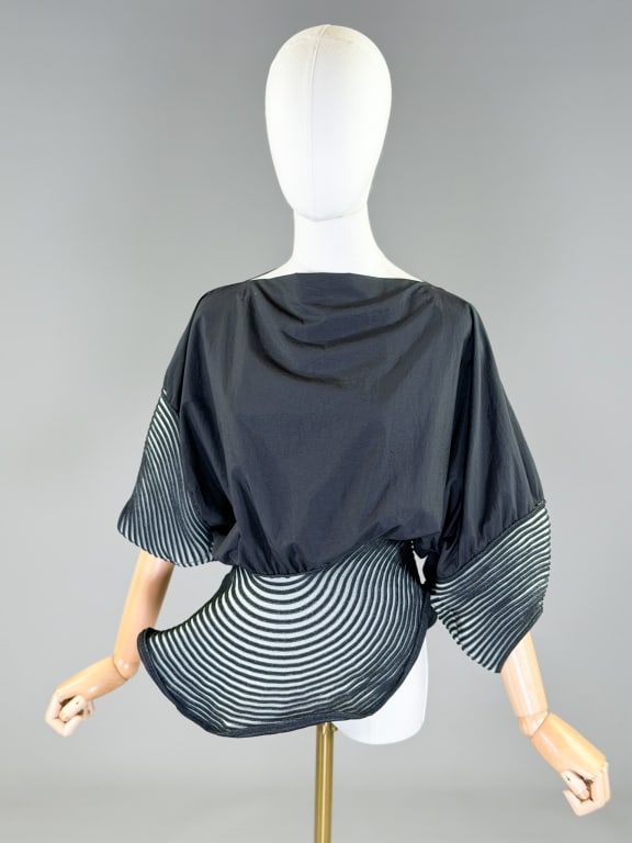 Vintage Issey Miyake Sculptural Knit Shirt Top: Vintage Issey Miyake Sculptural Knit Shirt Top having back neck snap closure and stretch through knit areas. Measuring free bust, 28-42 inch waist, 23 inches long, 8 inch sleeve length. From the lifet
